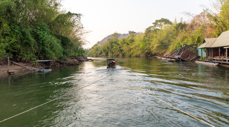 A boat floats on the River Kwai in Thailand.の写真素材