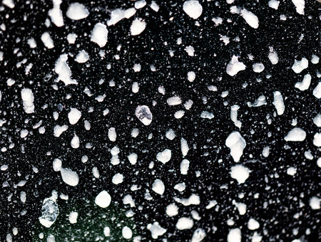 Dirt on the body of a black car. Abstract background.