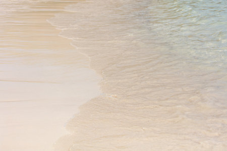 White sand on the seashore as an abstract background. Texture.