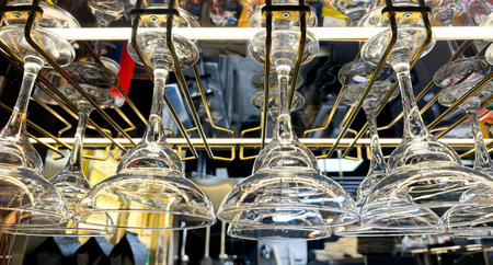 Glass glasses of champagne hang above the bar.