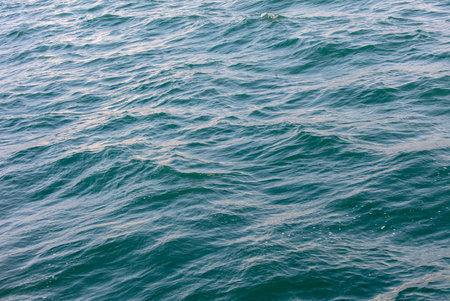 Blue water in the sea as an abstract background. Texture.