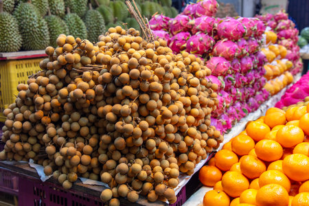 Langan fruits on a market counter.の写真素材