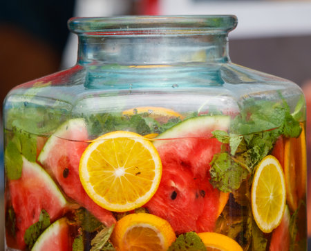 Lemonade with fruits and berries in a glass jar.の写真素材