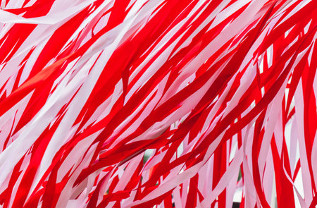 Red and white ribbons as an abstract background. Texture.