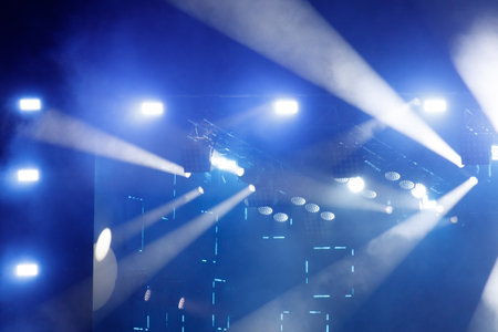 Blue light at a concert. Abstract background.の写真素材