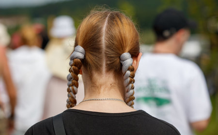 Braids on a girl's head. Back view.の写真素材