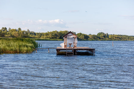 Wooden bridge on the lake in summer.の写真素材