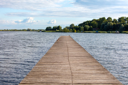 Wooden bridge on the lake in summer.の写真素材