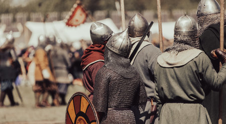 Knights in armor with weapons at war.