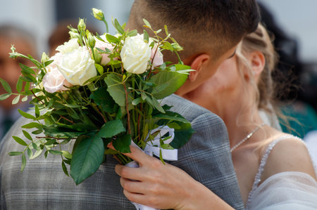 A bouquet of flowers in the hands of the bride.の写真素材