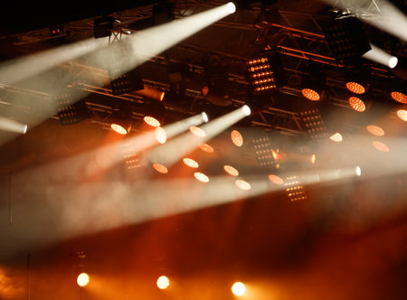 Red-orange color on stage at a concert.