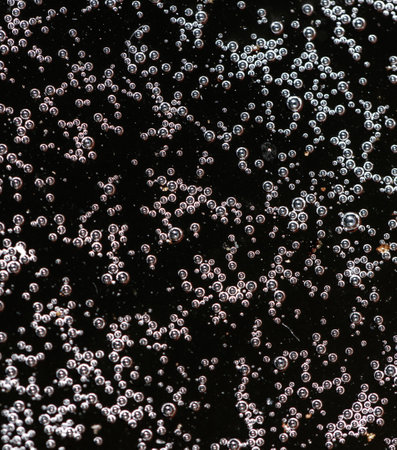 Balls of air on the surface of the water as a background. Macro.の写真素材