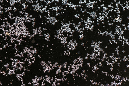 Balls of air on the surface of the water as a background. Macro.の写真素材