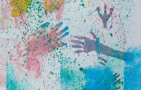 A colorful painting of many hands with different colors. The painting is full of life and energy. It seems to be a representation of the diversity and uniqueness of each individualの写真素材