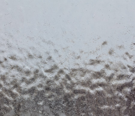 A blurry image of water. The water appears to be choppy and rough, with a lot of movement. The image has a sense of motion and energyの写真素材