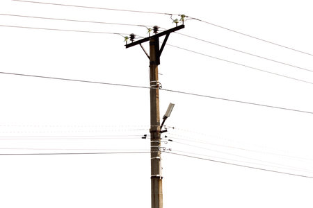 A tall pole with many wires coming out of it. The pole is surrounded by a white backgroundの写真素材