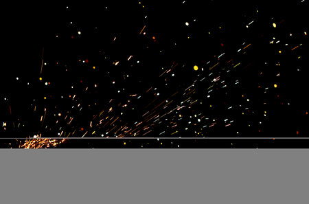 A black background with a lot of sparks and fire. The sparks are scattered all over the background,...