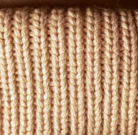 A close up of a knitted item with a lot of yarn. The yarn is in a variety of colors and the item is...