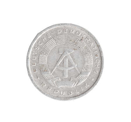 A coin with the word Demokratik on it. It is gray.
