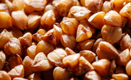 A close up of a pile of brown grains. The grains are small and appear to be dry. Concept of...
