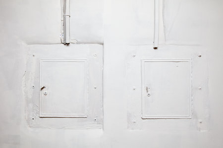 Two white doors with a white frame. The doors are not locked