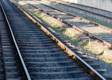 The train tracks are old and rusty. The tracks are empty and there is no train on themの写真素材