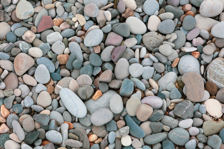 A pile of rocks with a variety of colors and sizes. Concept of ruggedness and natural beautyの写真素材