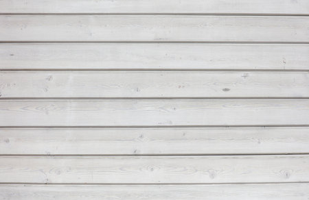 The image is a white background with a wooden texture. The wood grain is visible and the background is almost entirely whiteの写真素材