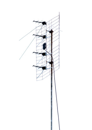A tall antenna with four antennas on top of it. The antenna is white and blackの写真素材
