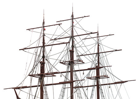 A large ship with a tall mast and a white background. The ship is old and has a lot of ropesの写真素材
