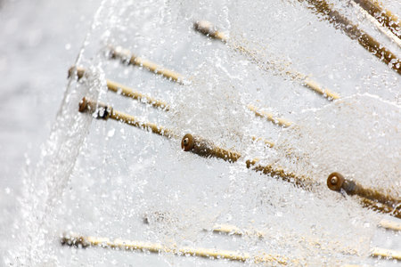 A close up of a snow covered landscape with a few sticks sticking out of the snow. The sticks are arranged in a way that they look like they are frozen in place. Concept of stillness and quietnessの写真素材