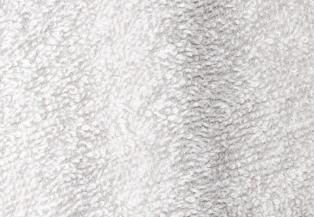 A white towel with a fuzzy texture. It is a close up of the towelの写真素材