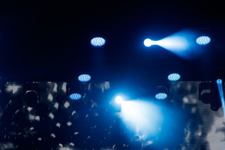 A group of lights that are all blue in color. The lights are arranged in a way that creates a sense of depth and movement, with some lights shining brighter than others. Scene is one of excitementの写真素材