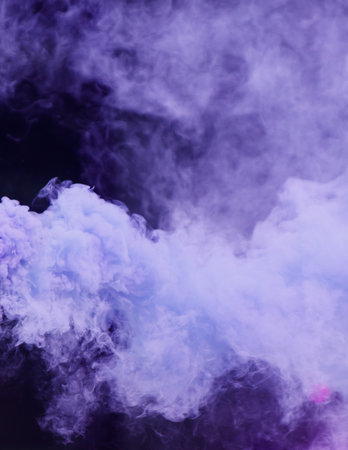 A purple smoke cloud with a blue tint. The smoke is thick and billowing, creating a sense of mystery and intrigueの写真素材