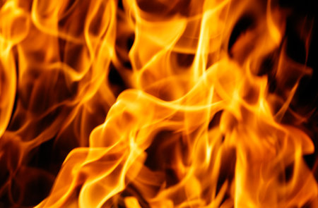 A close up of a flame with the idea of fire and danger. Scene is intense and ominous