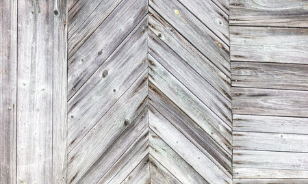 A wooden board with a zigzag pattern. The board is white in color. The pattern is made up of many small linesの写真素材