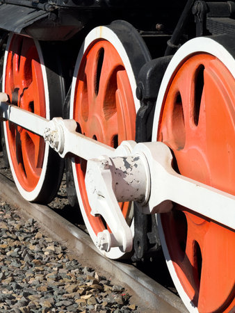 The train wheels are red and white. The red part is the rim and the white part is the hub