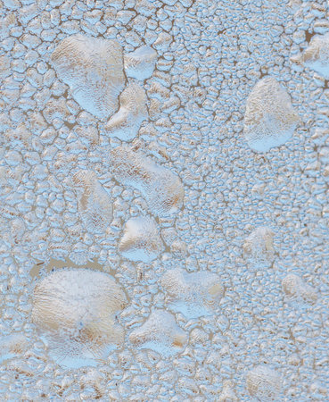Frozen water drops on glass as an abstract background. Texture.