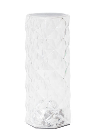A tall, clear glass vase with a white base. The vase is sitting on a white surfaceの写真素材