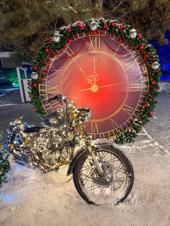 A motorcycle is decorated with Christmas lights and a large clock. The clock is red and gold and has...