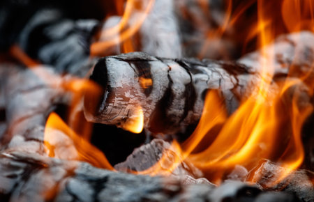 Close-up of burning charcoal as background.