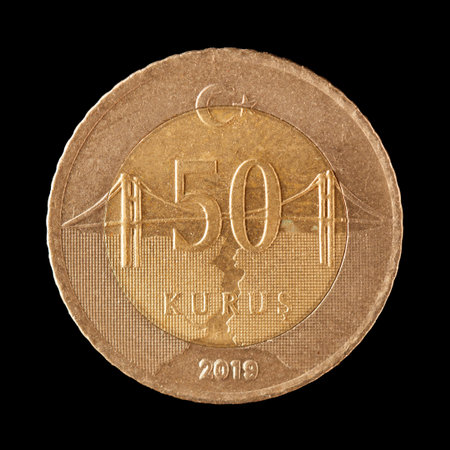 Turkish coin on black background.