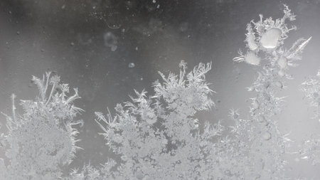 Frost pattern on window glass as background.