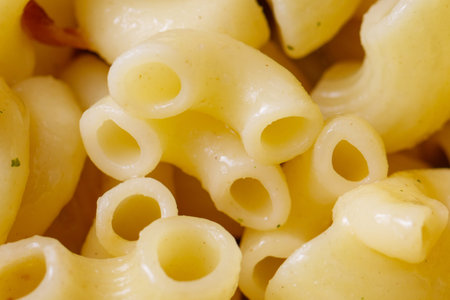 A pile of yellow pasta. The pasta is long and thinの写真素材