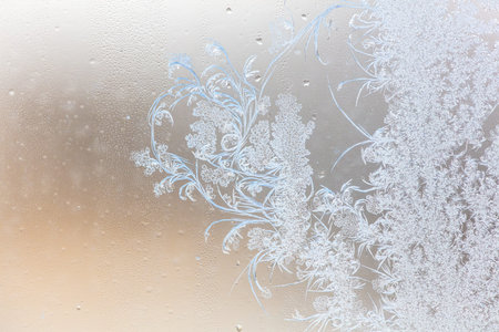 Frost pattern on window glass as background.