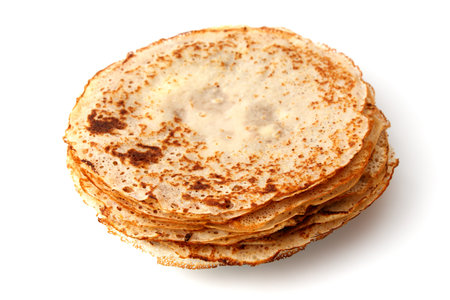 A stack of pancakes with a hole in the middle. The pancakes are golden brown and stacked on top of...