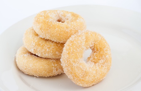 4 donuts on white plateの写真素材