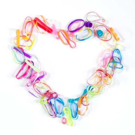 Heart shape made from colorful rubber bandの写真素材