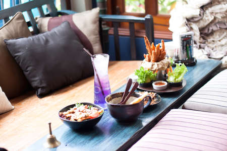 Bowls of lunch menu wth fried potatoes at the restaurantの写真素材
