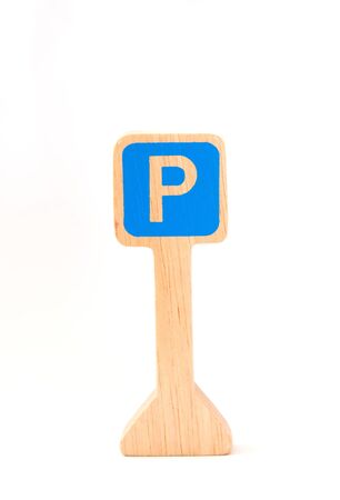 wooden toy made like parking sign on white backgroundの写真素材